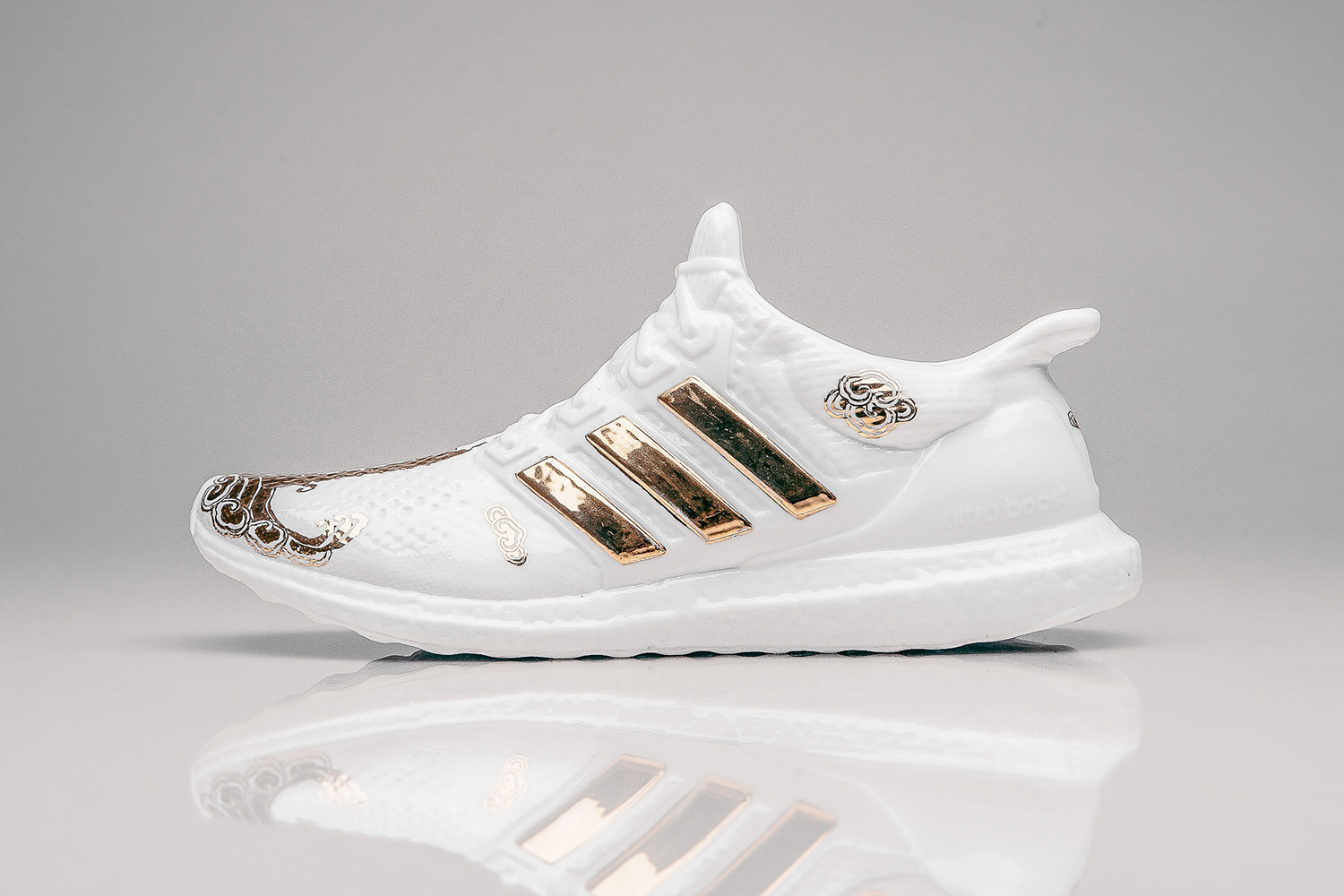 white and gold adidas trainers